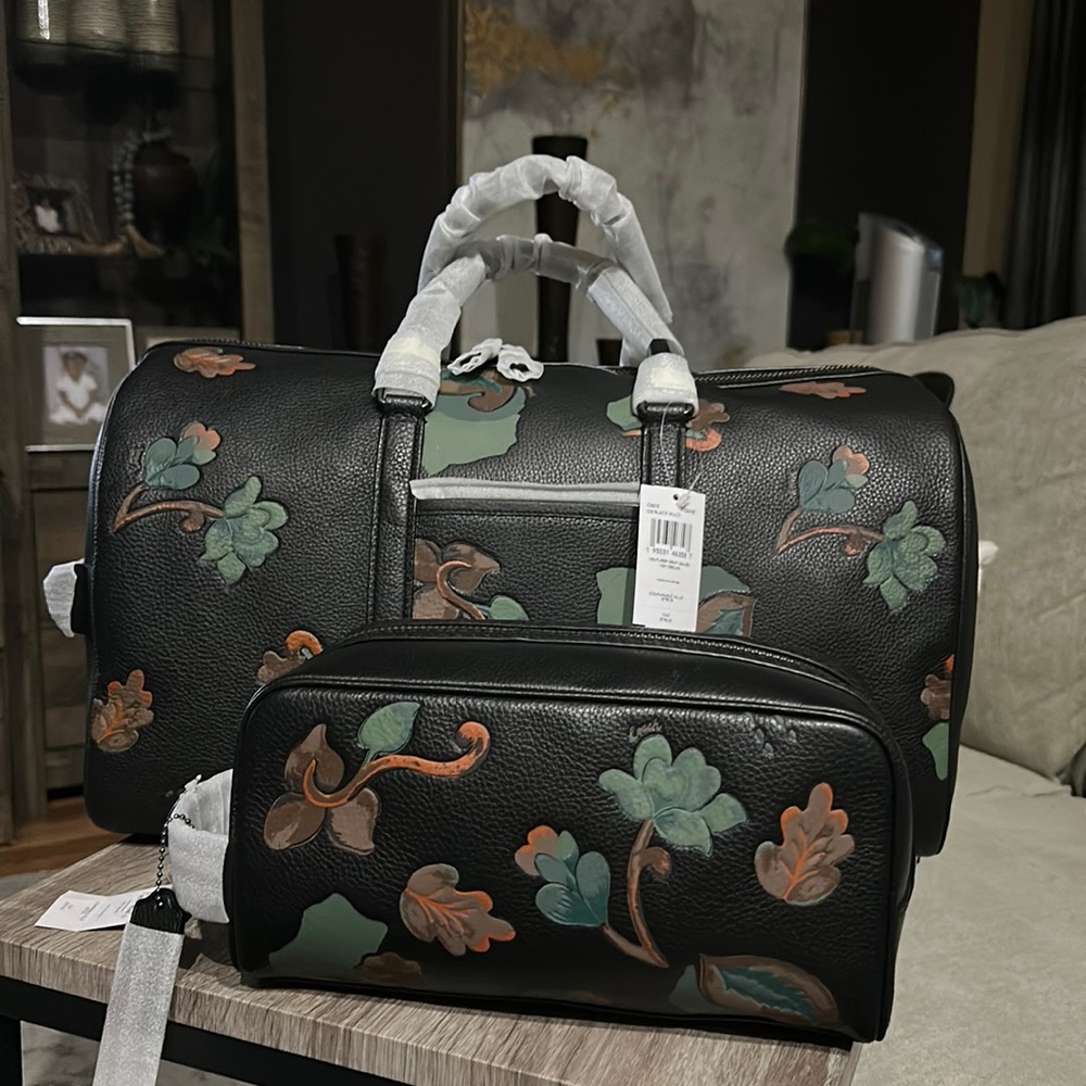 Coach Venturer DRMY Leaves Duffle Bag and matching toiletry bag.